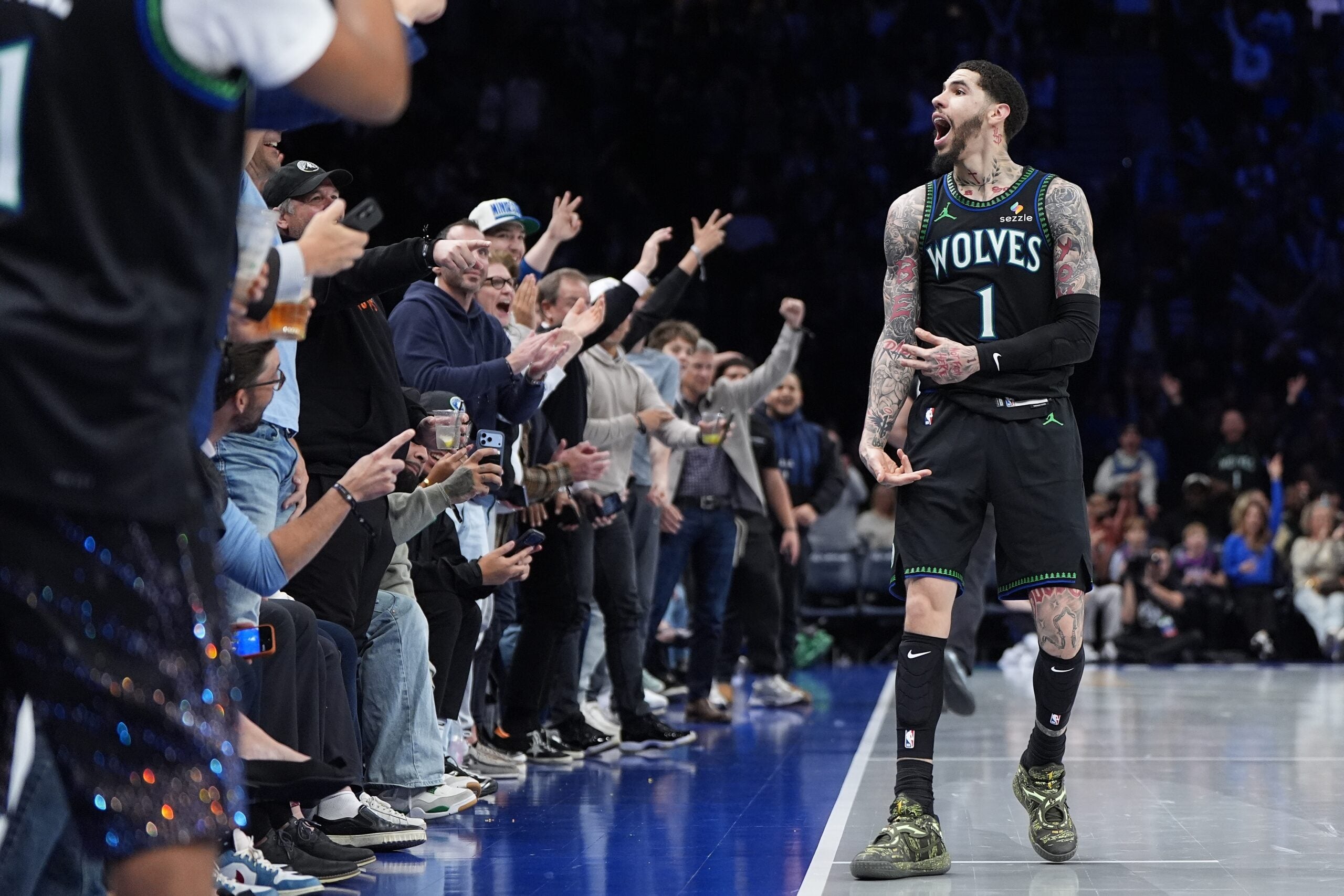 Timberwolves players celebrating a victory during an NBA game.